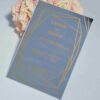 Luxury silver mirror acrylic wedding invitation featuring a geometric border and custom gold silk screen printing.