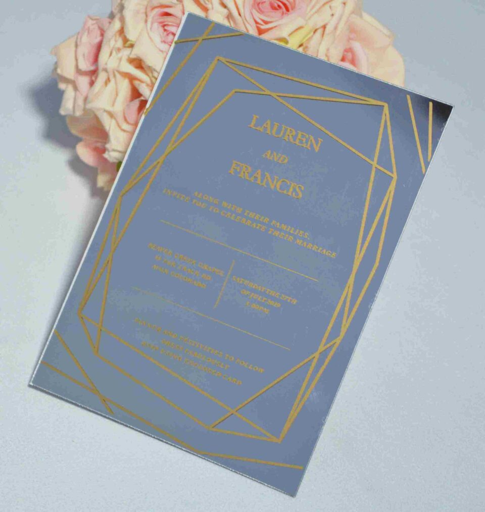 Luxury silver mirror acrylic wedding invitation featuring a geometric border and custom gold silk screen printing.