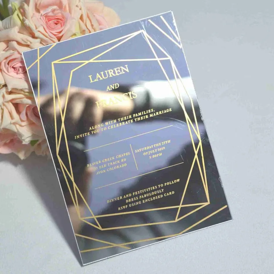 Luxury silver mirror acrylic wedding invitation featuring a geometric border and custom gold silk screen printing.