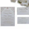 A rectangular, olive-green silk wedding invitation folio oriented vertically. The design features a gate-fold opening with two panels meeting in the center. A shimmering taupe or champagne-colored satin ribbon wraps horizontally around the folio, cinched at the middle by a large, sparkling silver rhinestone brooch with a geometric, butterfly-inspired silhouette. The folio is set against a plain white background, casting a soft shadow at the base.