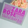 A square silver glitter Bat Mitzvah invitation with peach and pink roses.The invitation features a mix of textures and bold purple typography.