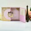 A high-angle view of an open pink silk gatefold invitation folio displayed on a white surface, accompanied by white and peach roses. The fairy-tale-themed suite includes: The center panel: Features a pink invitation card with a gold-bordered frame and the heading. It announces the celebration for in elegant gold script. Side pockets: The left and right panels contain pockets holding coordinating white cards with gold-foiled accents.Decorative details: Intricate gold laser-cut butterflies are tucked into the corners of the main invitation, which is secured by a thin pink satin ribbon pull-tab. The overall design is whimsical and romantic, using a soft pastel palette and shimmering gold highlights.A high-angle view of an open pink silk gatefold invitation folio displayed on a white surface, accompanied by white and peach roses. The fairy-tale-themed suite includes: The center panel: Features a pink invitation card with a gold-bordered frame and the heading. It announces the celebration for in elegant gold script. Side pockets: The left and right panels contain pockets holding coordinating white cards with gold-foiled accents.Decorative details: Intricate gold laser-cut butterflies are tucked into the corners of the main invitation, which is secured by a thin pink satin ribbon pull-tab. The overall design is whimsical and romantic, using a soft pastel palette and shimmering gold highlights.