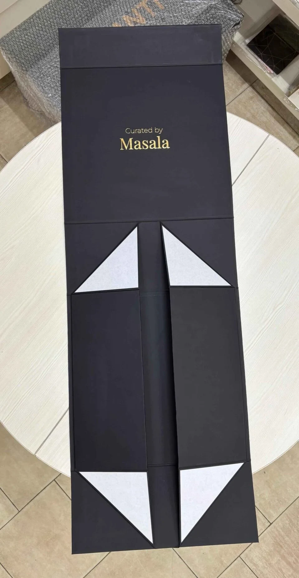 Flat-pack foldable rigid box design for luxury packaging storage.