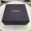 Matte black collapsible rigid box with gold foil logo branding. Assembled magnetic flip-top rigid box for premium retail.