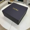 Matte black collapsible rigid box with gold foil logo branding.