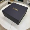 Matte black collapsible rigid box with gold foil logo branding.