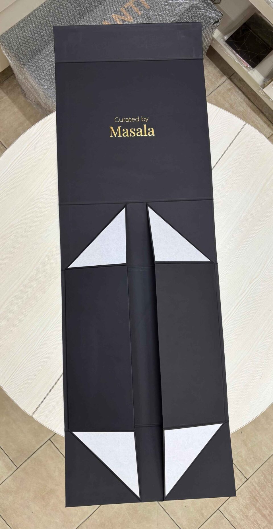 Flat-pack foldable rigid box design for luxury packaging storage.