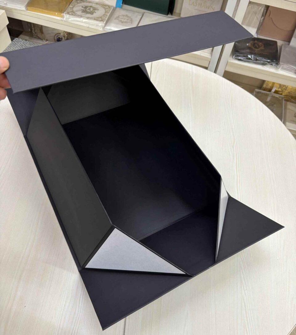 Flat-pack foldable rigid box design for luxury packaging storage.
