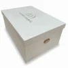 White Shimmer Top Bottom Bridal Lehenga Box with Gold Foil Logo Printing. Box is crafted from a rigid MDF core & Equipped with premium gold handles.